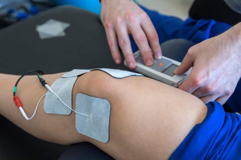 electronic therapy on knee used to treat pain